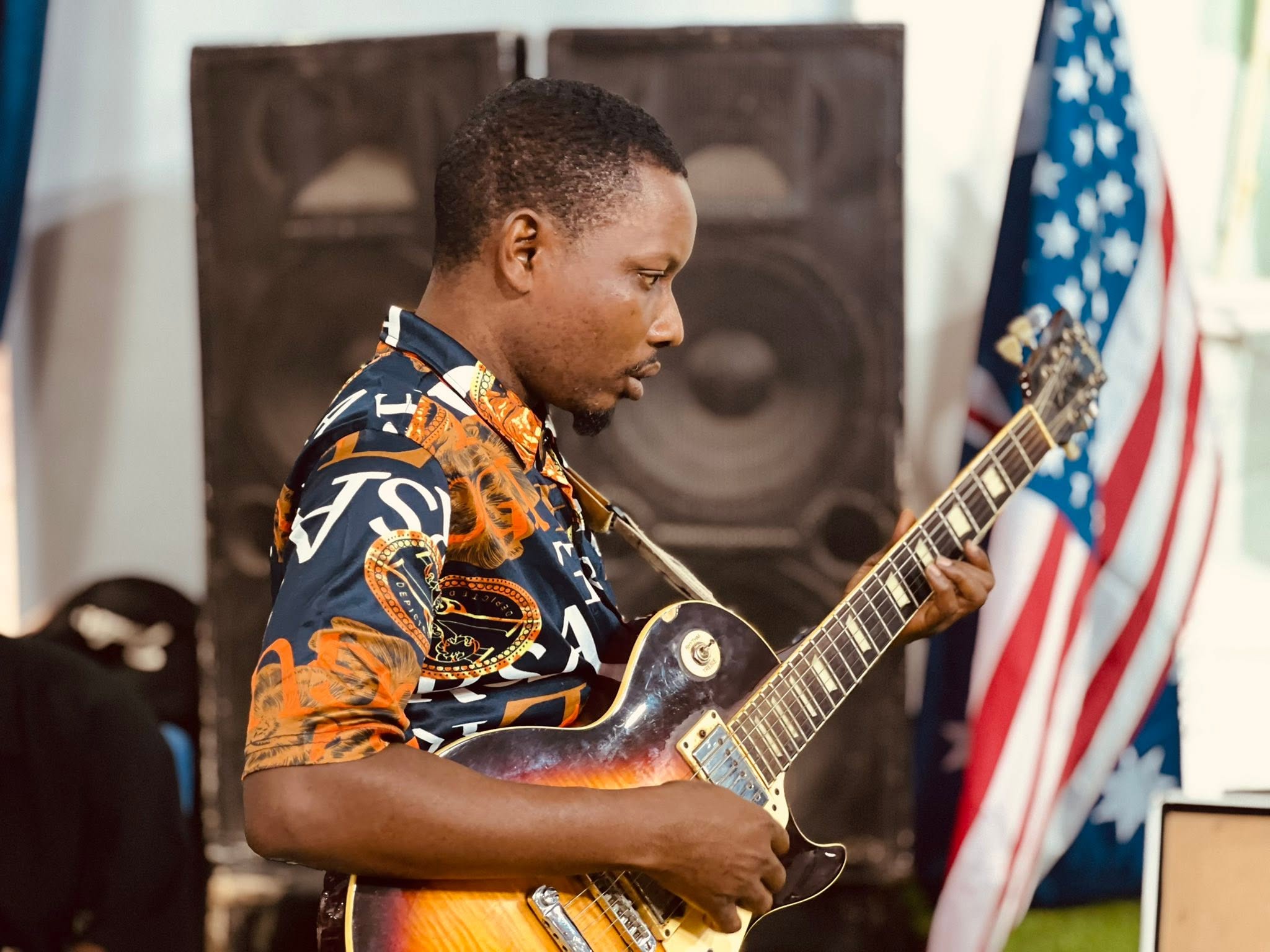 A guitarist playing during worship