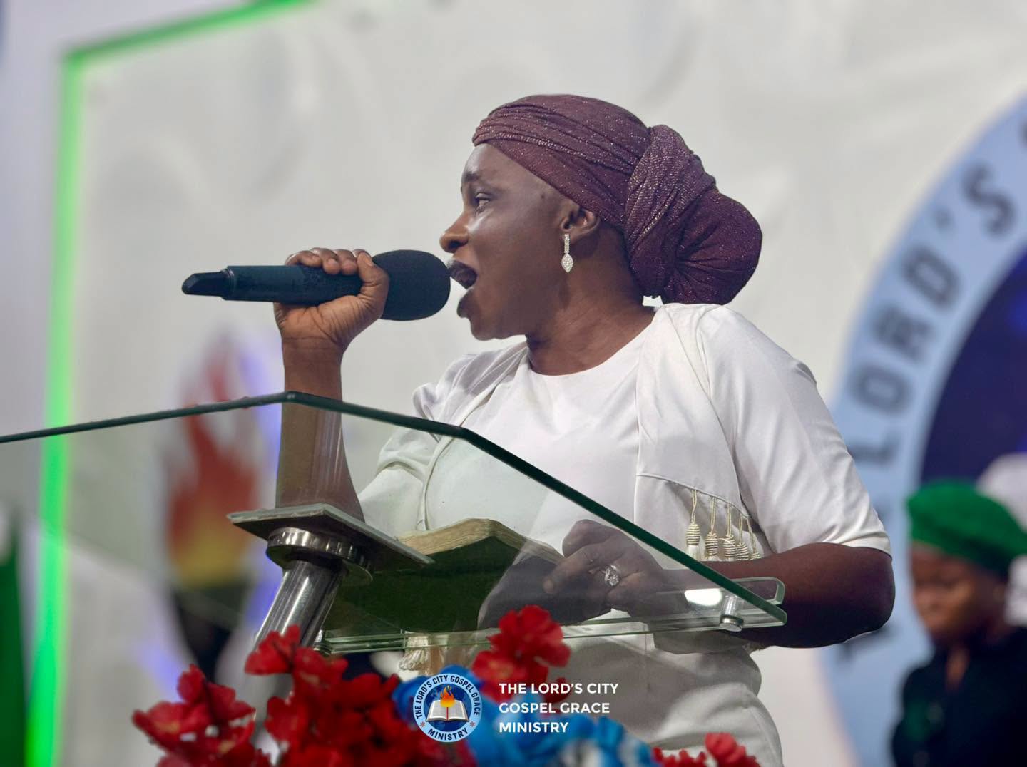 A worship leader singing at The Lord City